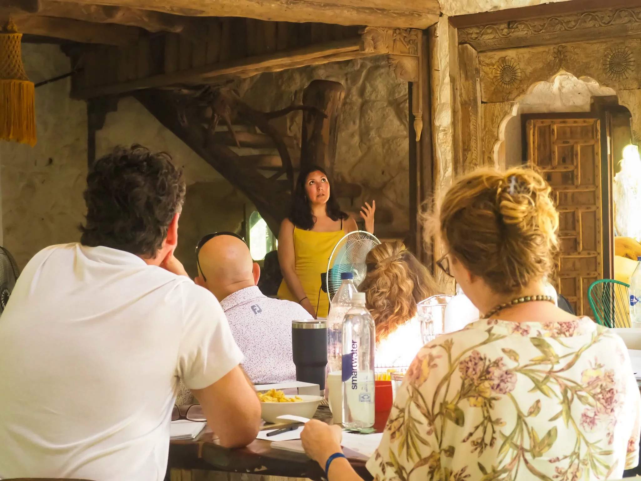 arilda surridge giving a presentation to her clients in a therapy retreat