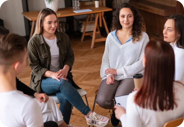 group of therapists in a circle discussing